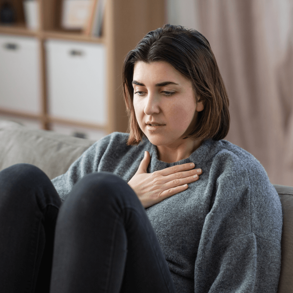 a picture of a woman deep breathing
