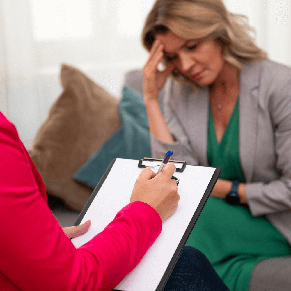 a picture of a woman talking to a therapist